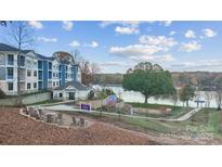 Modern apartment complex with lake views and outdoor seating area near lake at 4455 Reed Creek Dr # 202, Sherrills Ford, NC 28673