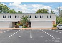 Inviting two-story townhouse with dedicated parking spots and landscaped grounds at 5949 Quail Hollow Rd # E, Charlotte, NC 28210