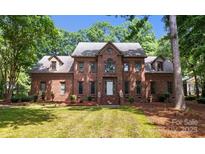 Charming two-story brick home with mature trees and a well-manicured front yard at 654 9Th N St, Albemarle, NC 28001