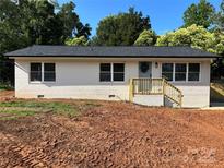 Charming, renovated single-story home featuring a classic brick facade and inviting front entrance at 756 Logan St, Mooresville, NC 28115