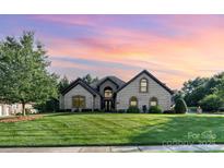 Charming brick home with a beautifully manicured lawn at 3441 Club Ridge Ct, Gastonia, NC 28056