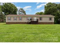 Charming single-Gathering home with a welcoming front porch and well-kept lawn, perfect for outdoor enjoyment at 828 Carver St # 17-19, Shelby, NC 28152