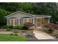 Charming single story home with well-maintained landscaping and inviting screened-in porch at 111 Trails End Ln, New London, NC 28127