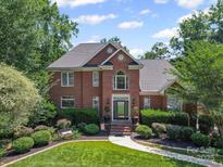 Beautiful two-story brick home with mature landscaping and a well-manicured lawn on a sunny day at 2769 Independence Way, Gastonia, NC 28056