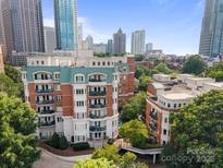 Attractive exterior shot of multi-story apartment building in downtown area with lush landscaping at 415 N Church St # 311, Charlotte, NC 28202