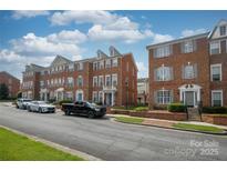 Charming brick townhome with manicured landscaping and a welcoming entrance at 11123 Waxberry Dr, Charlotte, NC 29277