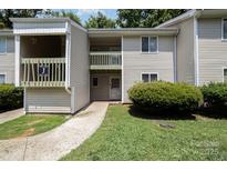Inviting condo with well-maintained landscaping, and walkway leading to the entry at 1602 Eagles Pl # J103, Rock Hill, SC 29732