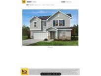 Charming two-story home featuring light gray siding, blue shutters, and a welcoming entry porch at 2021 Indian Trail Fairview Rd, Indian Trail, NC 28079