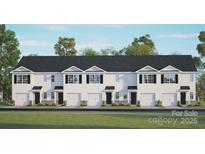 New construction townhome with a white facade, a row of garages, and a lush green lawn at 3136 Ora Smith Rd, Lincolnton, NC 28092