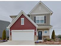 Charming two-story home with a two-car garage and a mix of siding and brick accents at 3629 Cerelia Ln, Denver, NC 28037