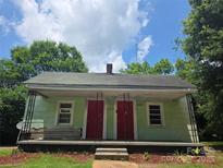 Quaint home with two front doors and a covered porch at 424 Congress S St, York, SC 29745