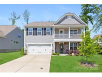Charming two-story home featuring a welcoming front porch and well-maintained lawn at 2439 Judson Dr, Gastonia, NC 28054