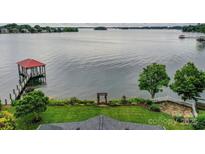 Expansive lake view with gazebo and lush landscaping from this waterfront property at 7945 Placid Ct, Denver, NC 28037