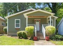 Charming bungalow home features a quaint front porch, landscaped yard, and inviting curb appeal at 113 W 5Th Ave, Gastonia, NC 28052