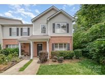 Charming townhome with a combination of brick and siding, complemented by well-maintained landscaping at 3561 Calpella Ct, Charlotte, NC 28262