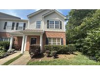 Charming two-story townhouse with a brick facade and well-manicured landscaping at 3561 Calpella Ct, Charlotte, NC 28262