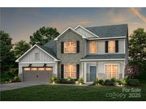 Charming two-story home showcases stone accents, a two-car garage, and manicured landscaping, offering a welcoming curb appeal at 13932 Penbury Rd # 400, Charlotte, NC 28278
