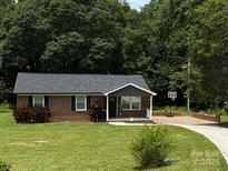 Charming brick home with a well-maintained lawn and a basketball hoop, offering a welcoming curb appeal at 232 Harmony Hills Dr, Catawba, SC 29704