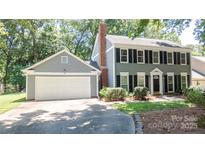 Charming two-story home with a well-manicured lawn and a two car garage, perfect for families at 3008 Heathcroft Ct, Charlotte, NC 28269