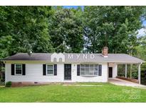 Charming single-story home featuring a welcoming front porch and well-maintained landscaping at 4308 Pinto Ln, Gastonia, NC 28052