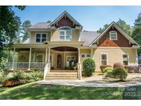 Charming two-story home with a welcoming porch and landscaped front yard offers great curb appeal at 6184 Chandler Rd, Clover, SC 29710