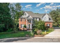 Charming two-story home with a brick and siding exterior and well-maintained landscaping at 3500 Cedar Springs Sw Dr, Concord, NC 28027