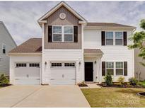 Charming two-story home with a two-car garage, nicely landscaped yard, and lovely curb appeal at 5121 Arbordale Way, Mount Holly, NC 28120