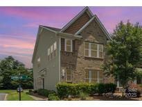 Charming two-story home with brick and siding exterior and manicured landscaping at 9001 Lanark Ln, Fort Mill, SC 29707