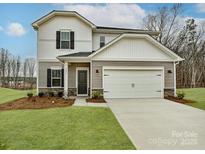 Charming two-story home with a two-car garage, manicured lawn, and inviting front entrance at 1117 Morehead Dr, Salisbury, NC 28144