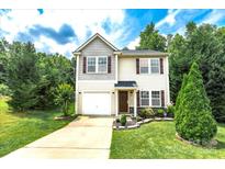 Charming two-story home with manicured lawn and inviting front entrance at 1548 Logan Patrick Ct, Gastonia, NC 28052