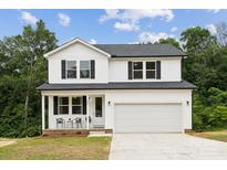 Charming two-story home with a white exterior, black shutters, and a covered front porch at 384 Speedway Pl, Concord, NC 28027