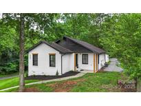 Charming home with fresh exterior paint, black trim, and a well-maintained front yard at 922 Maurice St, Monroe, NC 28112