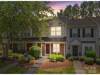 Charming townhome with a landscaped front yard and welcoming entrance at 12516 Hennigan Place Ln, Charlotte, NC 28214