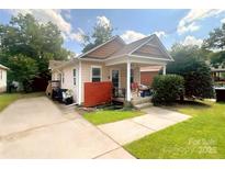 Charming single-Gathering home with a cozy front porch and well-maintained lawn, perfect for outdoor relaxation at 379 Sharpe St, Mooresville, NC 28115