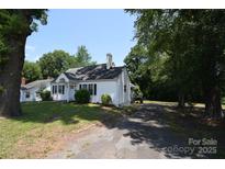 Charming single-story home with mature trees and a spacious front yard at 506 Linwood Rd, Gastonia, NC 28052