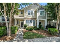 Charming townhome with stone accents, well-maintained landscaping, and inviting curb appeal at 529 River Park Rd, Belmont, NC 28012