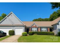 Charming home with a well-manicured lawn, a two-car garage, and a welcoming entrance at 4454 Glenlea Commons Dr, Charlotte, NC 28216