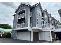 Charming three-story condo featuring double balconies and convenient garage access at 508 N Graham St # N, Charlotte, NC 28202