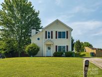 Charming two-story home with a well-maintained front yard, appealing curb appeal and a cozy, inviting entrance at 5701 Silver Eagle Dr, Charlotte, NC 28214