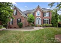 Charming brick two-story home with manicured lawn and arched doorway, perfect for curb appeal at 184 Melbourne Dr, Fort Mill, SC 29708