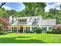 Charming two-story home features a well-manicured lawn and inviting curb appeal at 2011 Fromby Ct, Charlotte, NC 28211