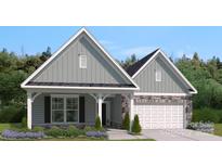 Charming home showcasing a harmonious blend of siding and stone accents, enhanced by professionally landscaped yard at 5123 Raging Creek Dr, Indian Trail, NC 28079