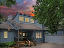 Inviting home featuring a front porch, well-maintained landscaping, and a side-entry garage at 106 Boyter Ct, Cramerton, NC 28032