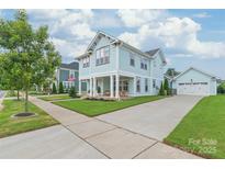 Charming two-story home with a welcoming porch and a well-manicured lawn at 257 Auburn View Rd, Rock Hill, SC 29730