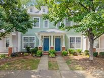 Charming townhome featuring dual front doors and manicured landscaping at 435 Hurston Cir, Charlotte, NC 28208