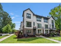 Charming townhome featuring modern design, beautiful landscaping, and a well-maintained lawn at 2969 Simpson Dr, Charlotte, NC 28205