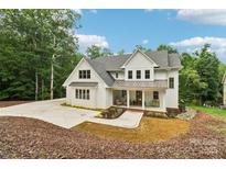 Stunning two-story home with a modern farmhouse design and manicured landscaping at 416 Plantation Way # 3, Mount Gilead, NC 27306