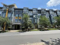 Modern condominium building with a well-maintained facade and landscaping at 514 W 10Th St # 403, Charlotte, NC 28202