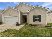Charming single-Gathering home with a well-maintained lawn and attached one-car garage at 10328 Kempsford Dr, Charlotte, NC 28262