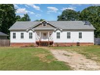Charming single-story home featuring a welcoming front porch and well-maintained lawn at 1593 Bloomfield Rd, Rock Hill, SC 29732